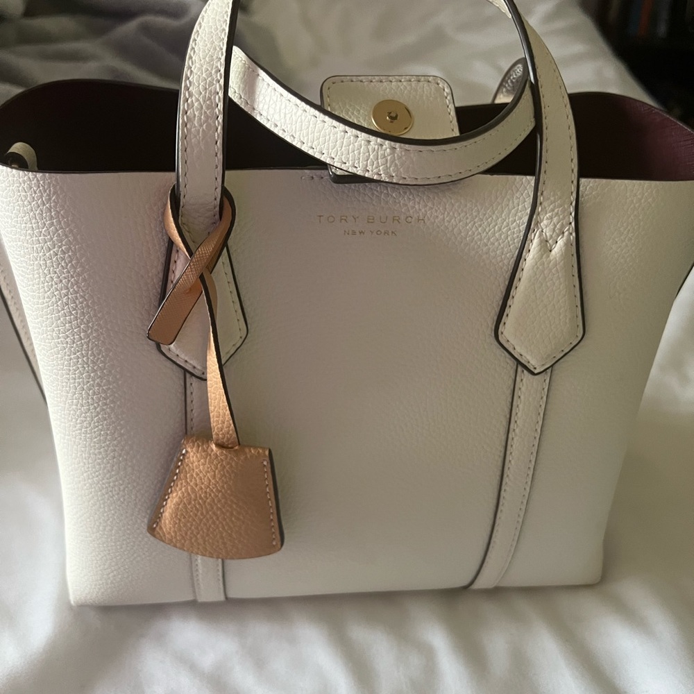 White Tory Burch small Perry triple compartment tote bag.